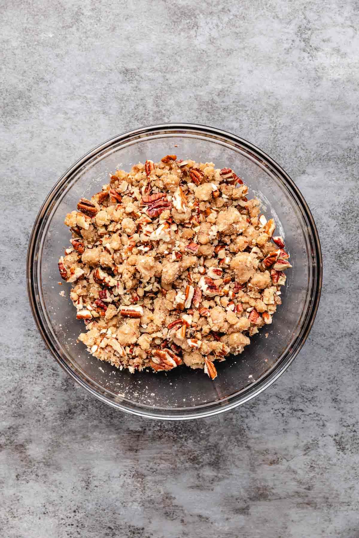 Unbaked pecan streusel in a bowl.