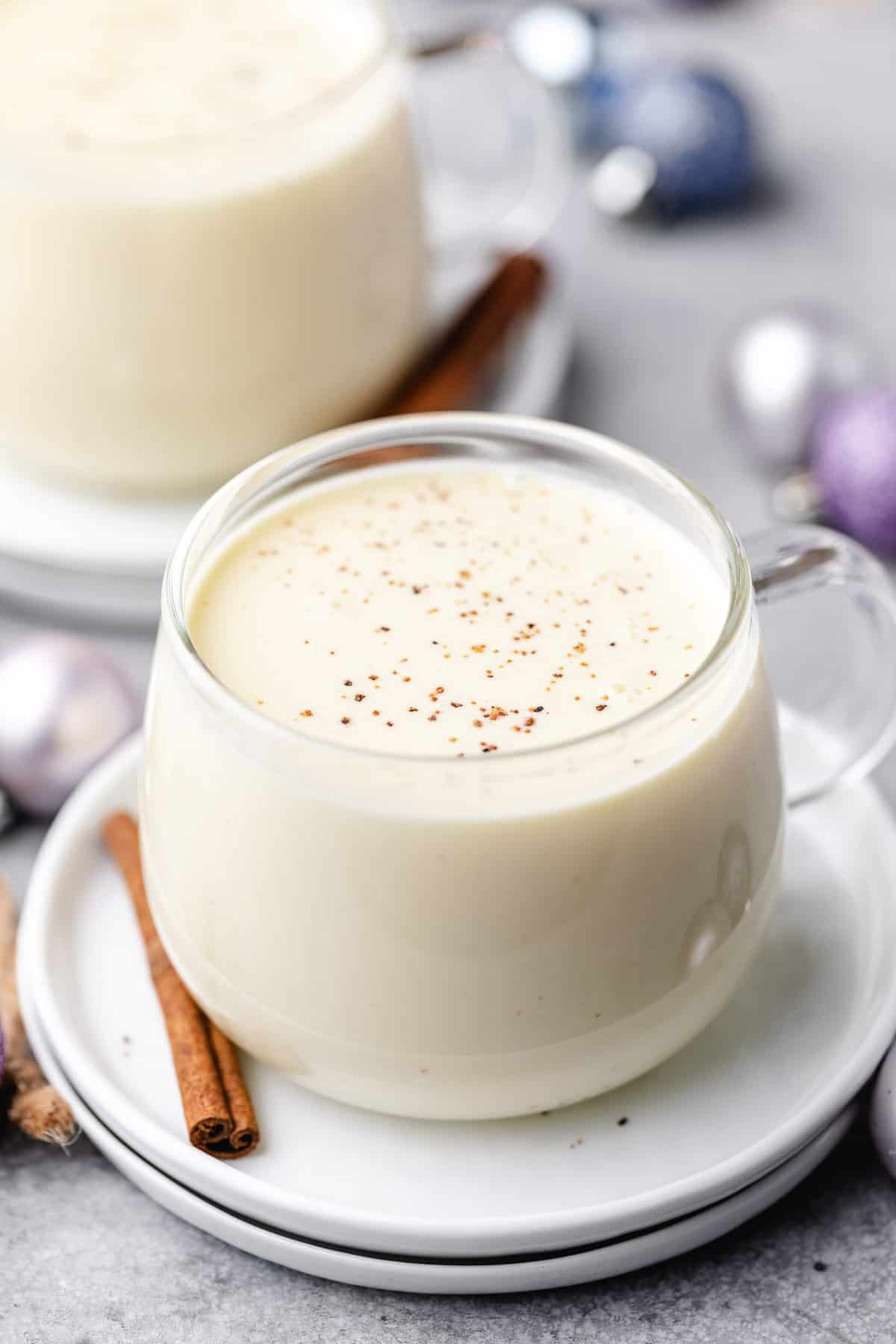 Nutmeg sprinkled over a cup of eggnog.