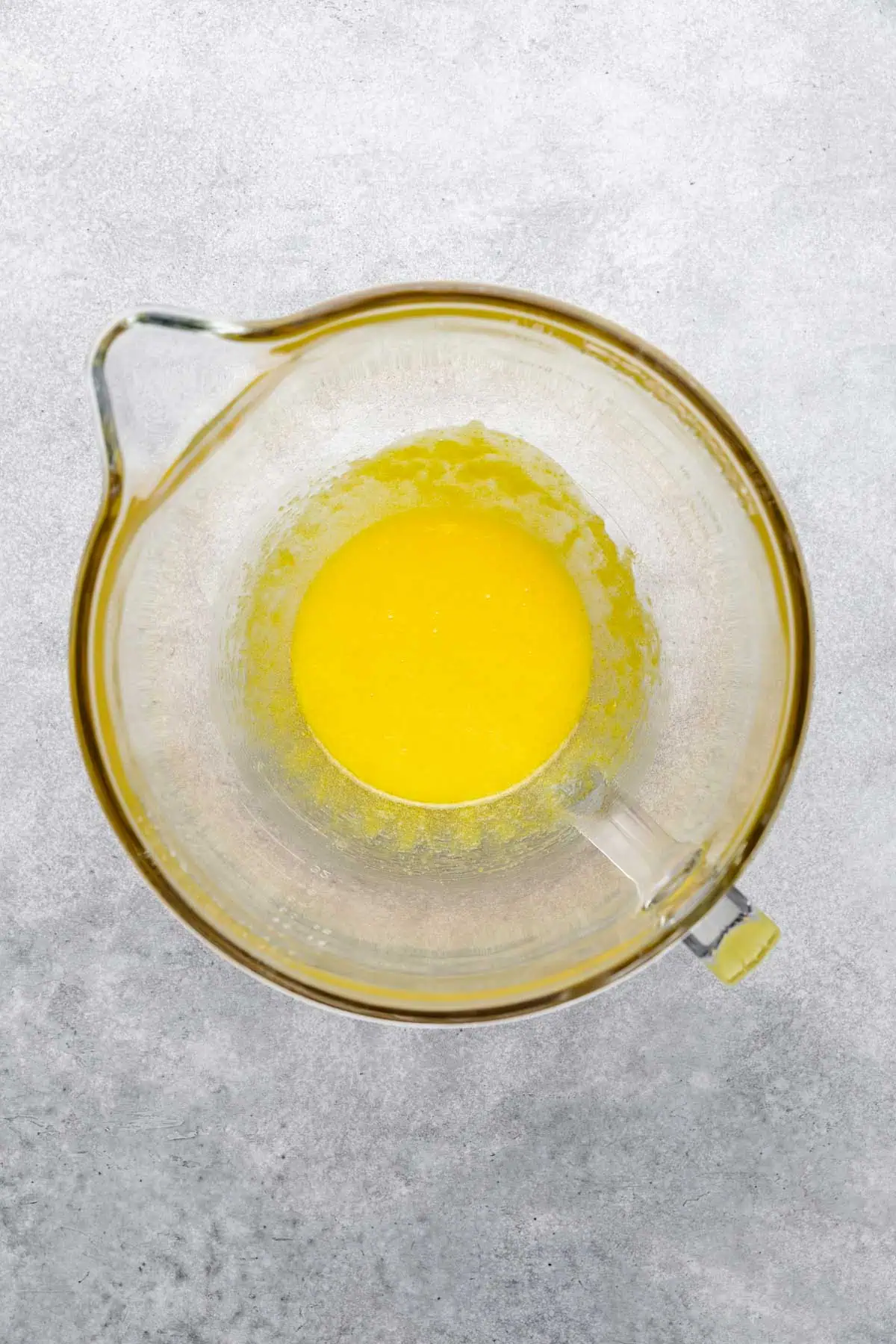 Egg yolks and sugar in a mixing bowl.