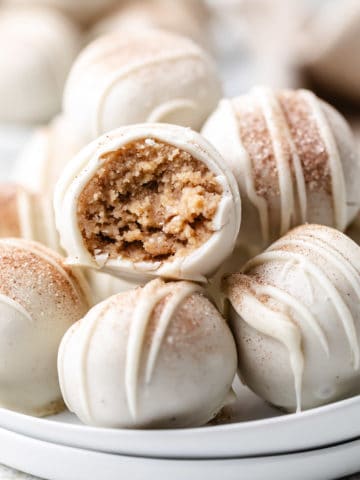 Plate of truffles with cinnamon and sugar.