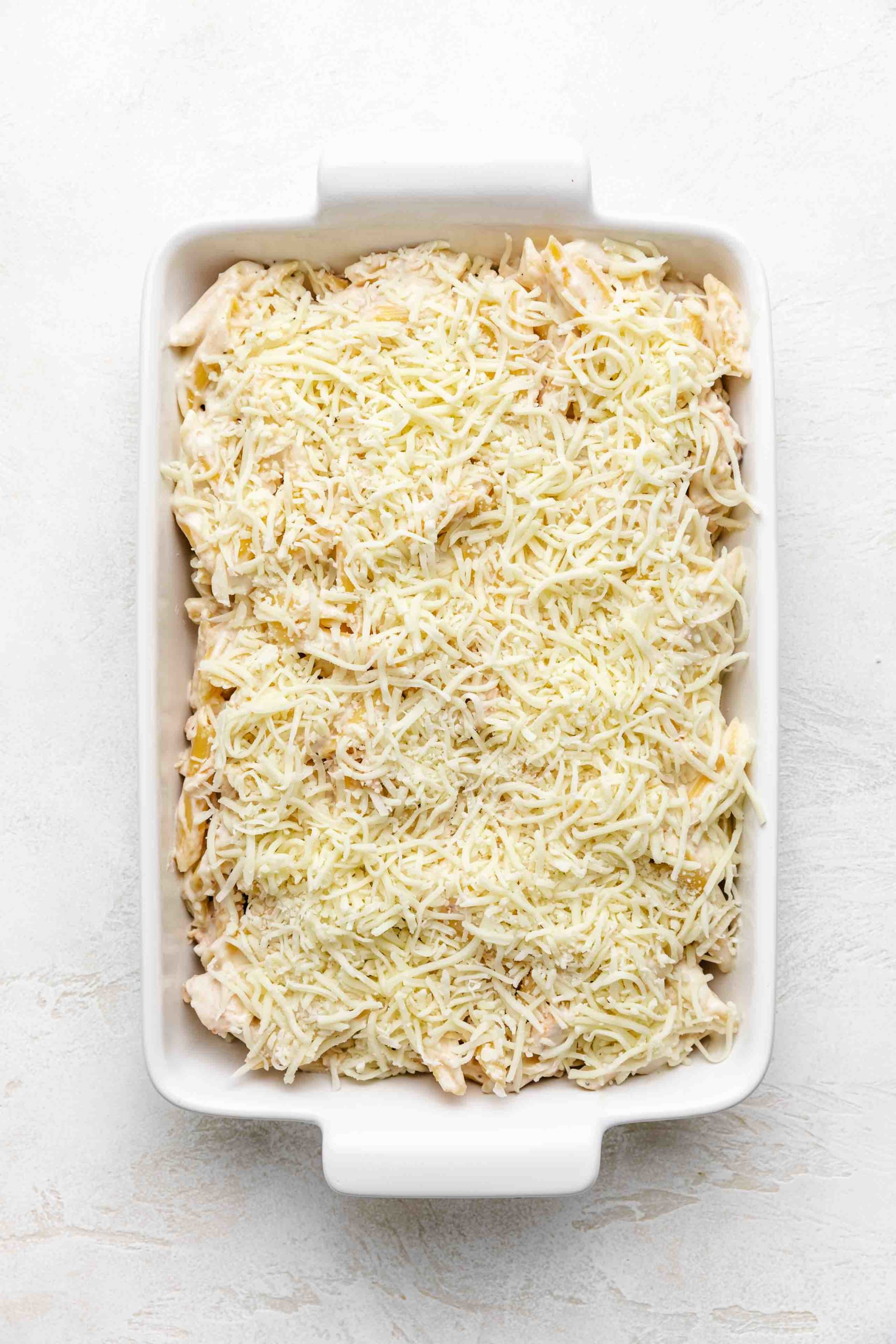 Mozzarella cheese sprinkle over pasta bake.