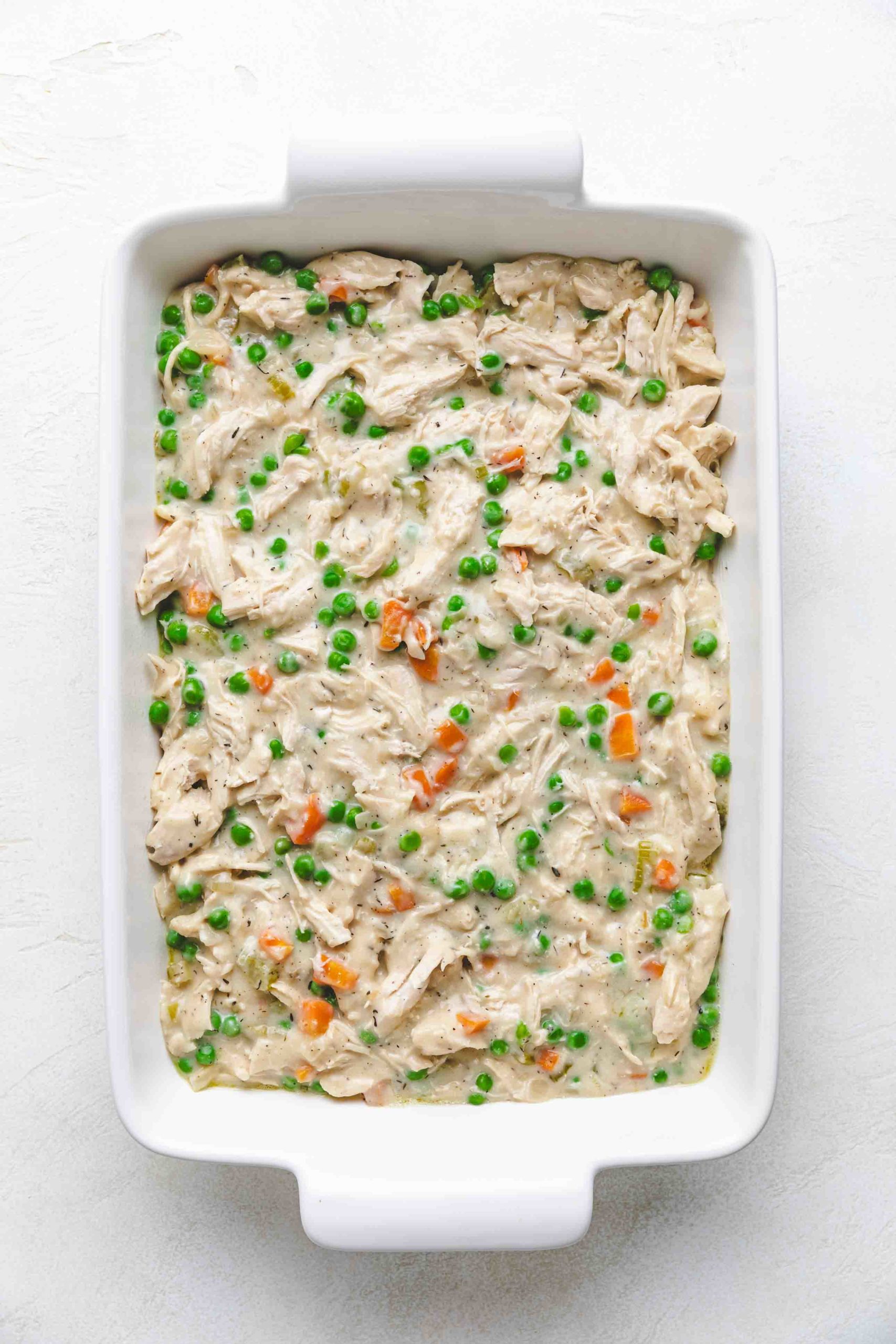 Chicken and vegetable filling in a baking dish.