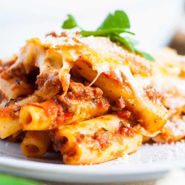 Scoop of baked ziti on a plate.