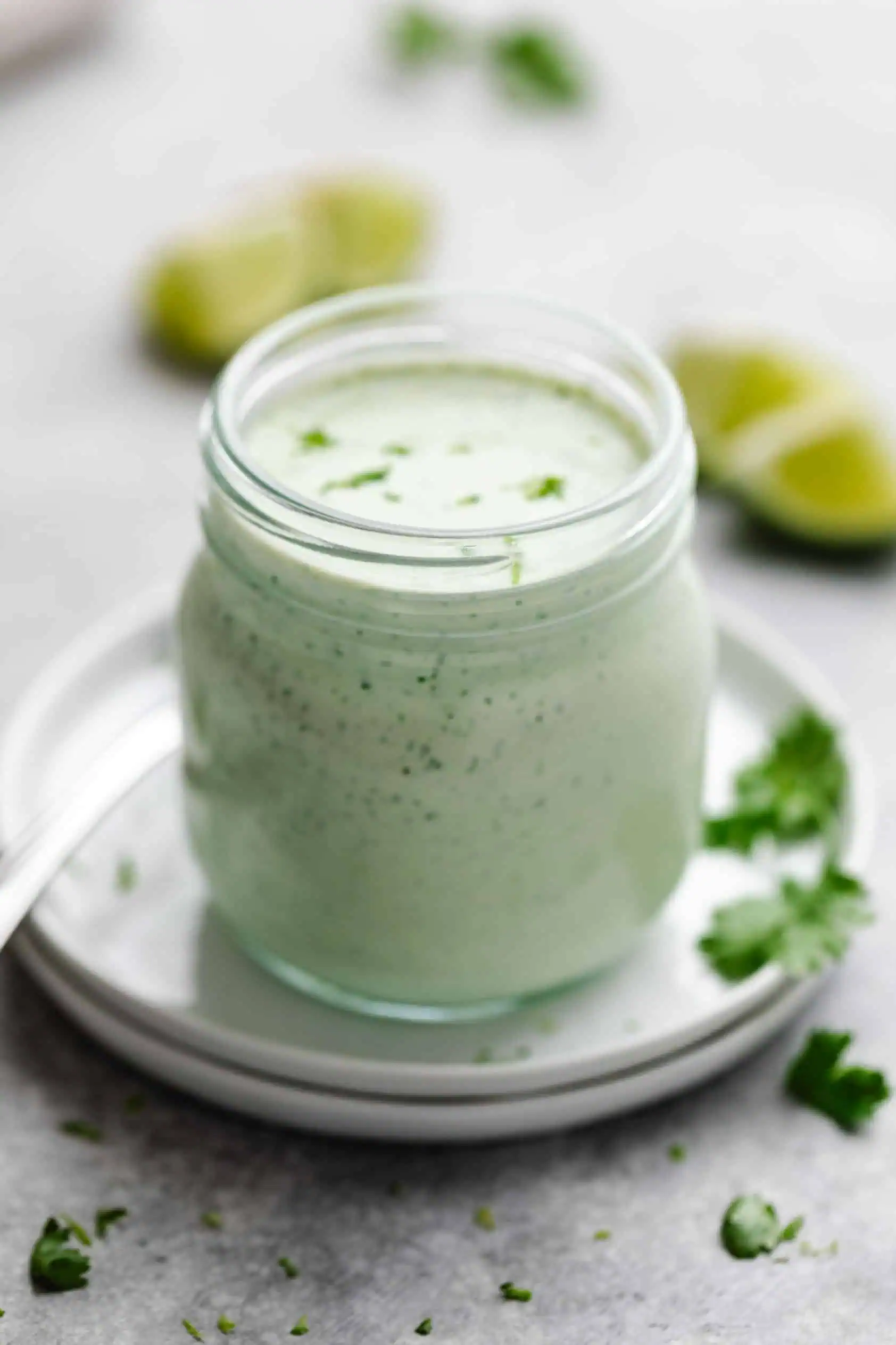 Side view of crema in a glass jar.