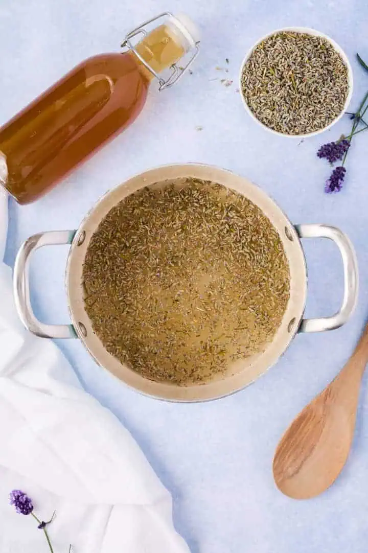 Dried lavender in a pan with sugar and water.