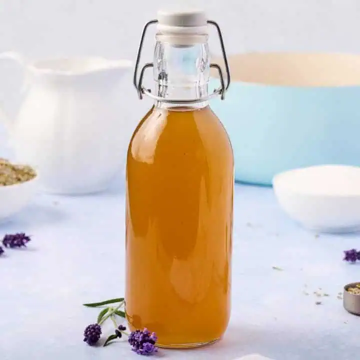 Side view of a jar of lavender simple syrup.