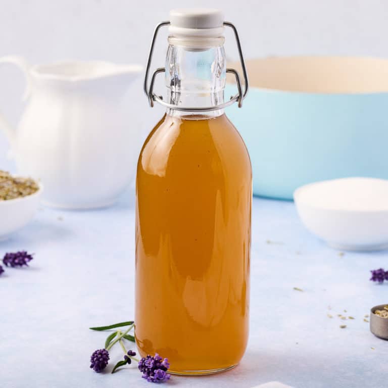Side view of a jar of lavender simple syrup.