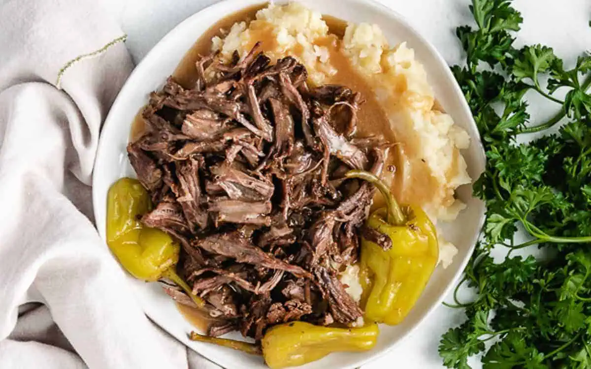 Mississippi pot roast and gravy on potatoes.