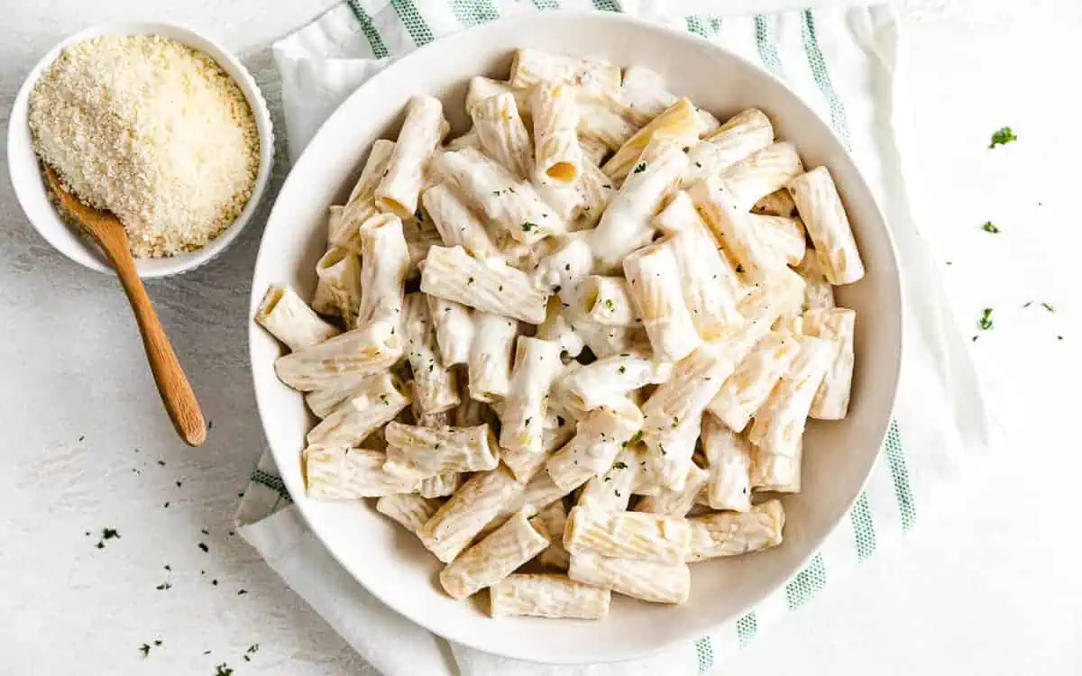 Top down view of cream cheese pasta in a dish.