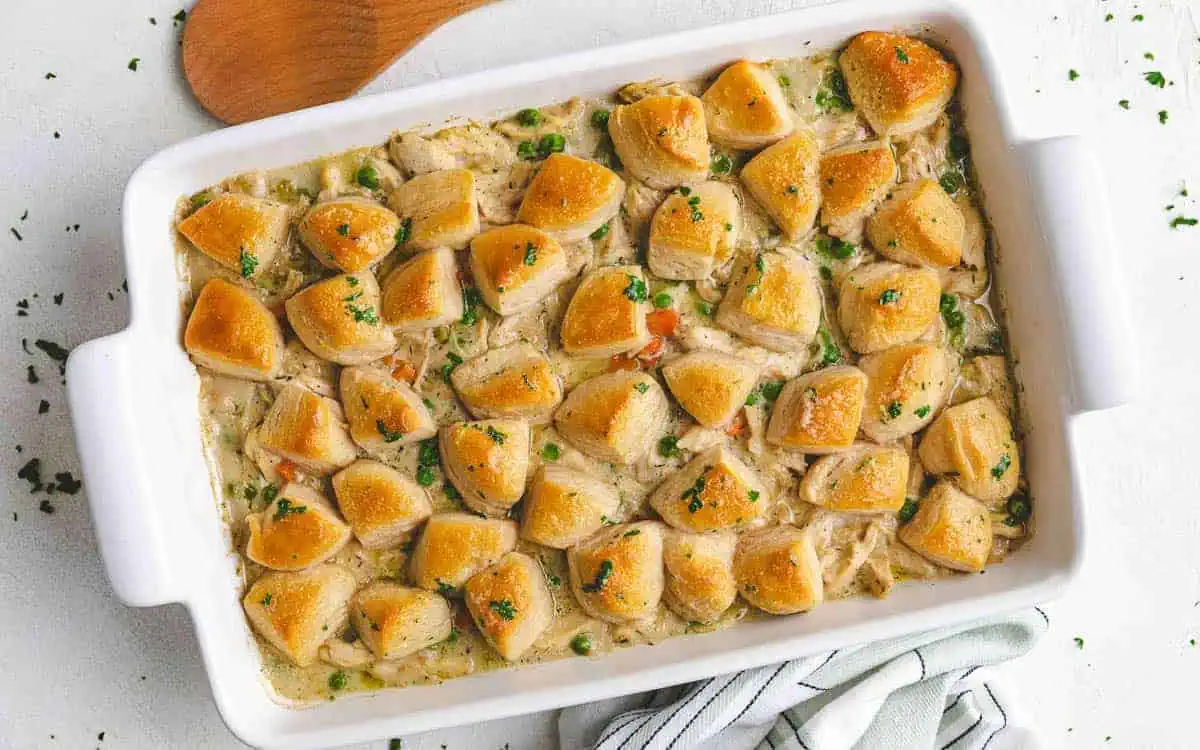 Chicken and biscuits in a casserole dish.