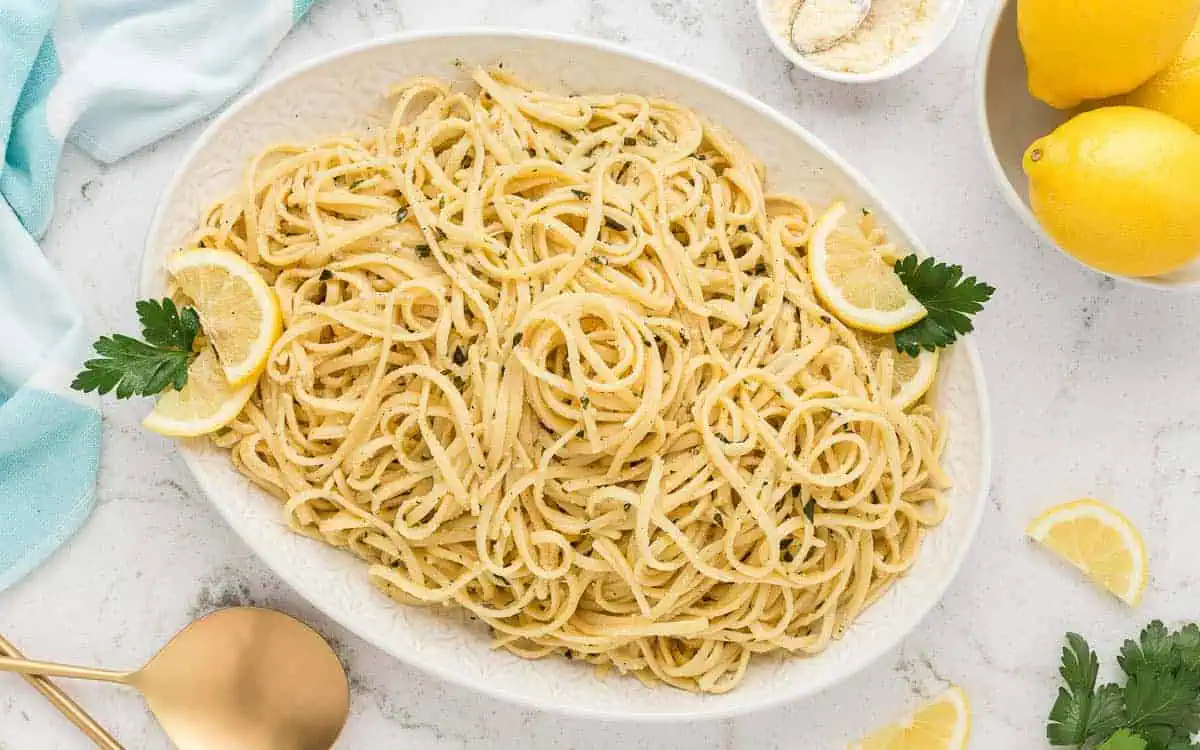 Lemon basil pasta on a white plate.
