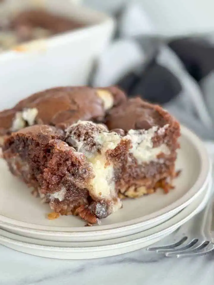 Slice of earthquake cake with cream cheese.