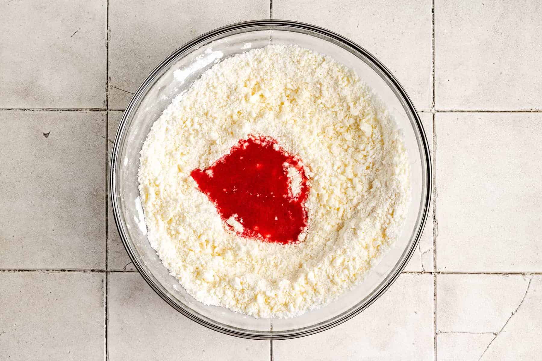 Strawberry puree poured into powdered sugar and butter.