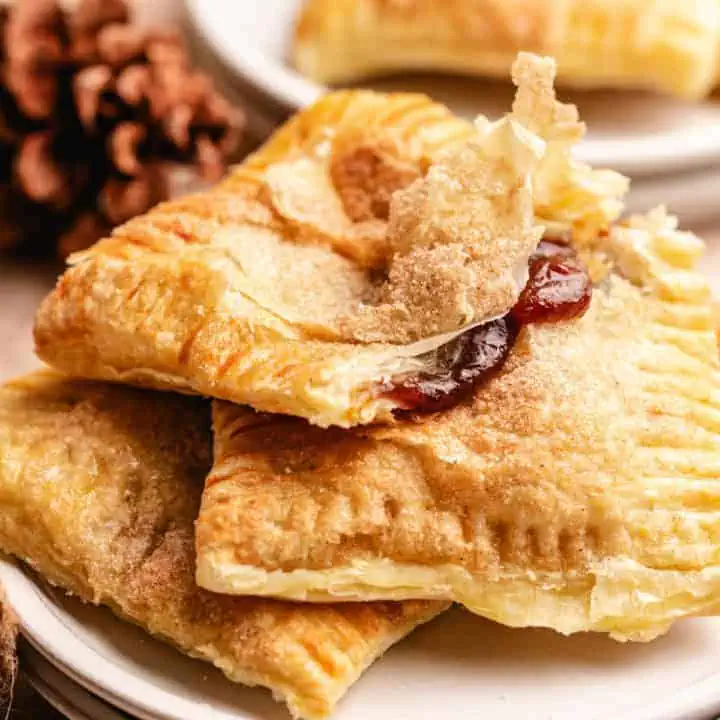 Pumpkin butter hand pies with a flaky puff pastry crust, showcasing the best hand pies recipe for fall foods and Thanksgiving desserts.