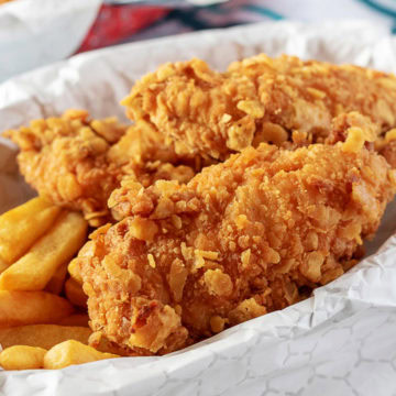 Crispy chicken tenders in a basket.