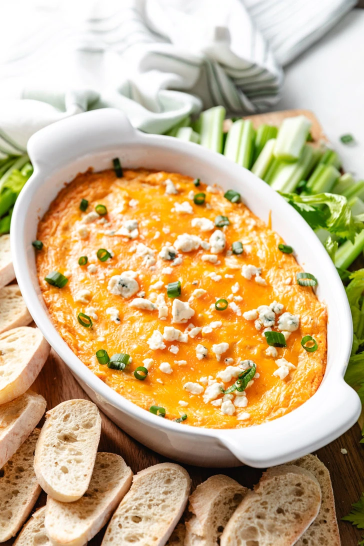 Baking dish filled with cheesy chicken dip.