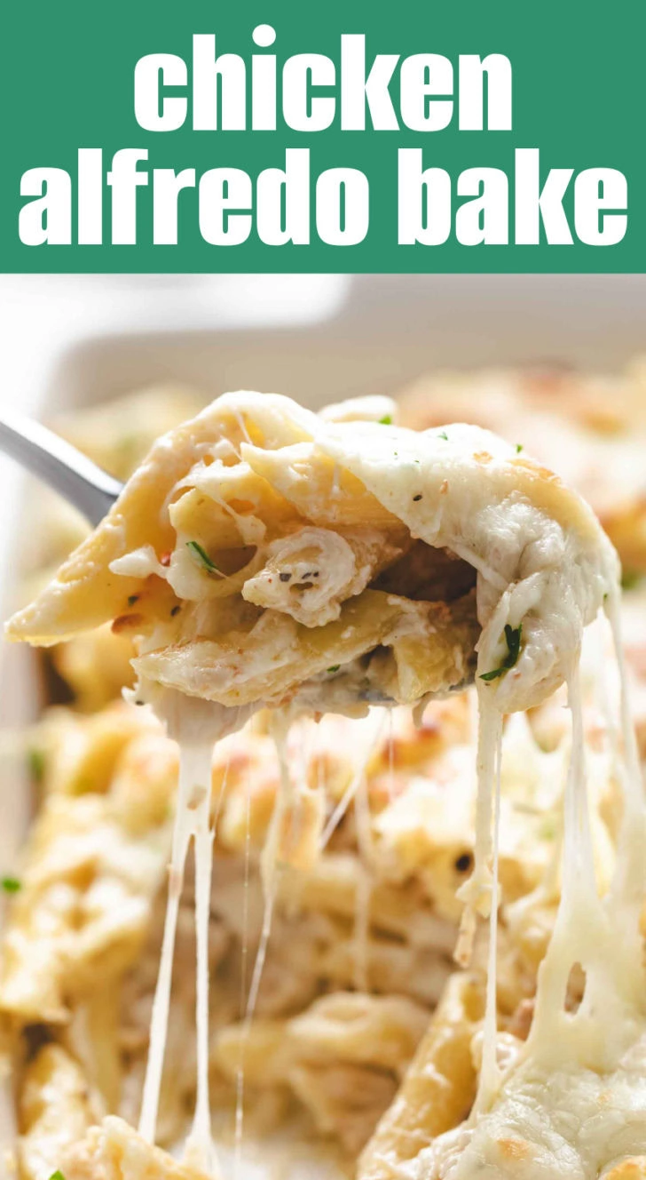 Chicken alfredo being scooped with a metal spoon.