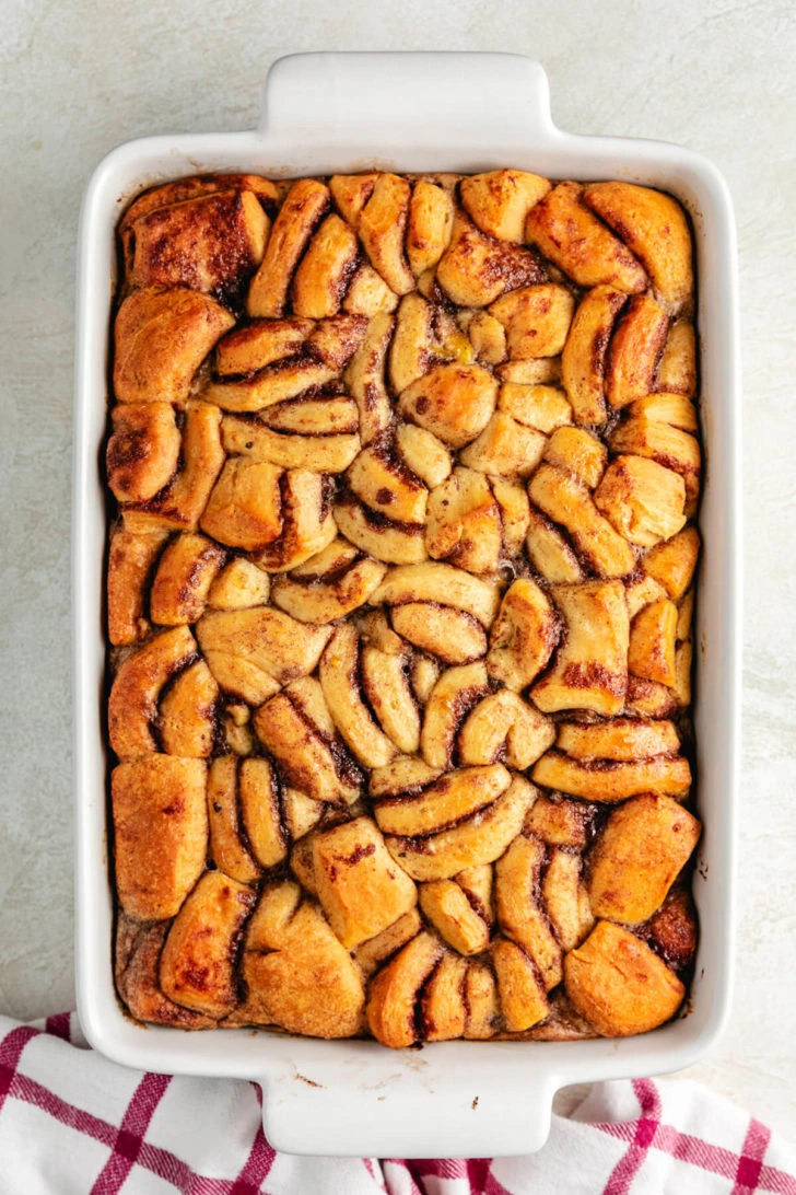 Pan of cinnamon roll french toast bake without bake.