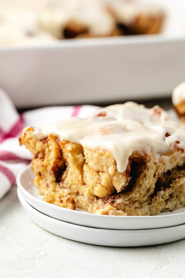 Breakfast casserole on a stack of plates.