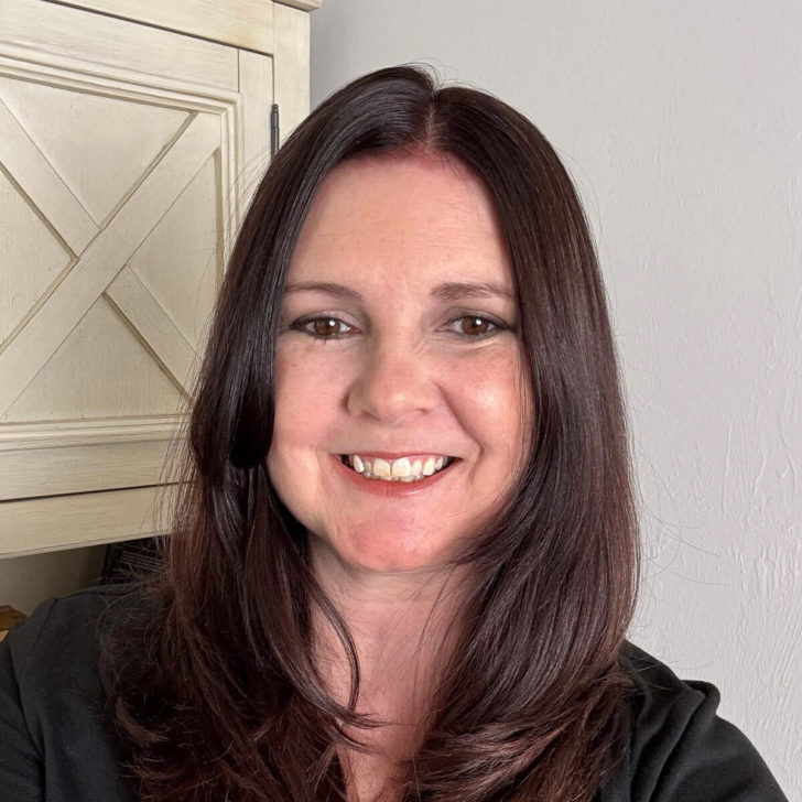 Photo of kimberly vargo in front of a bookcase.