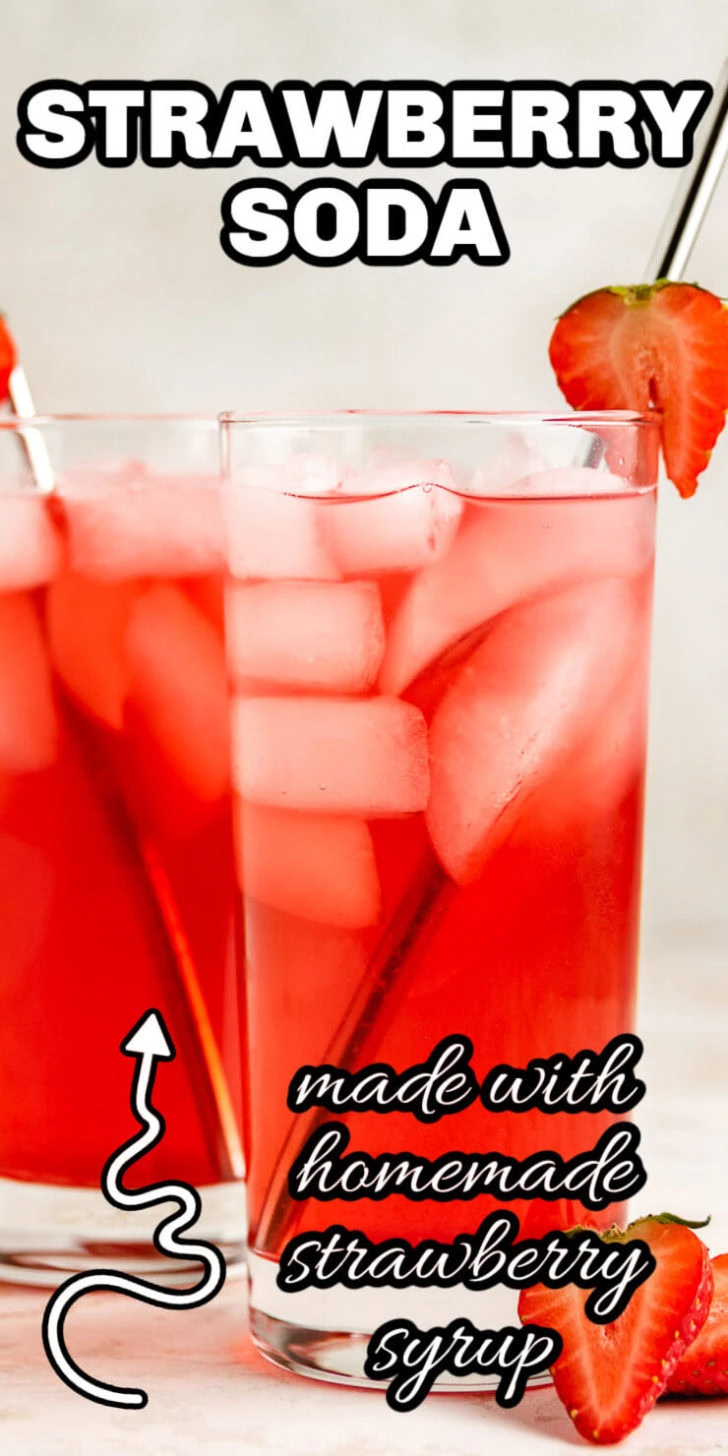 Close up view of strawberry flavored soda in a glass.