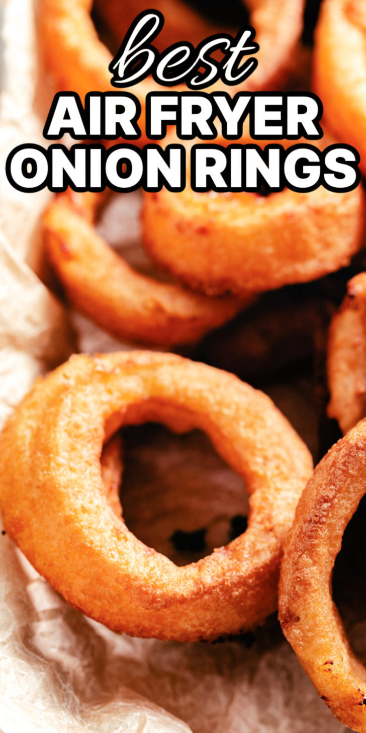 Air fryer frozen onion rings on parchment paper.