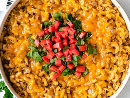 Close up view of a skillet of cheeseburger casserole.