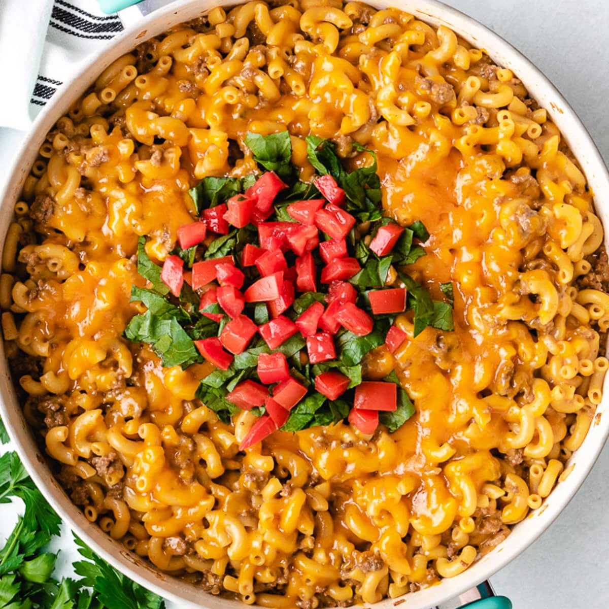 Close up view of a skillet of cheeseburger casserole.