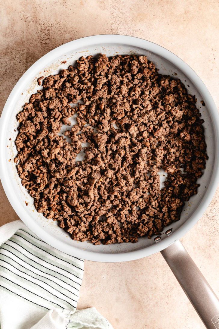 A pan filled with ground beef.