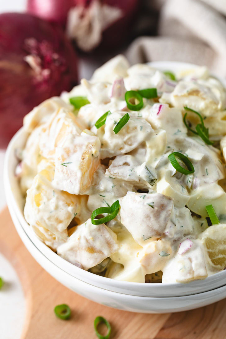 Dill Pickle Potato Salad Potato salad with mayo, sour cream, and green onions.