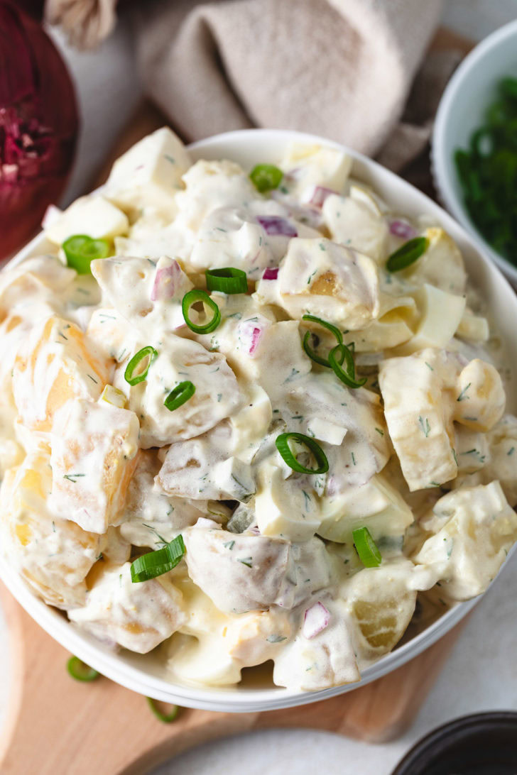 Potato salad with pickles and onions.
