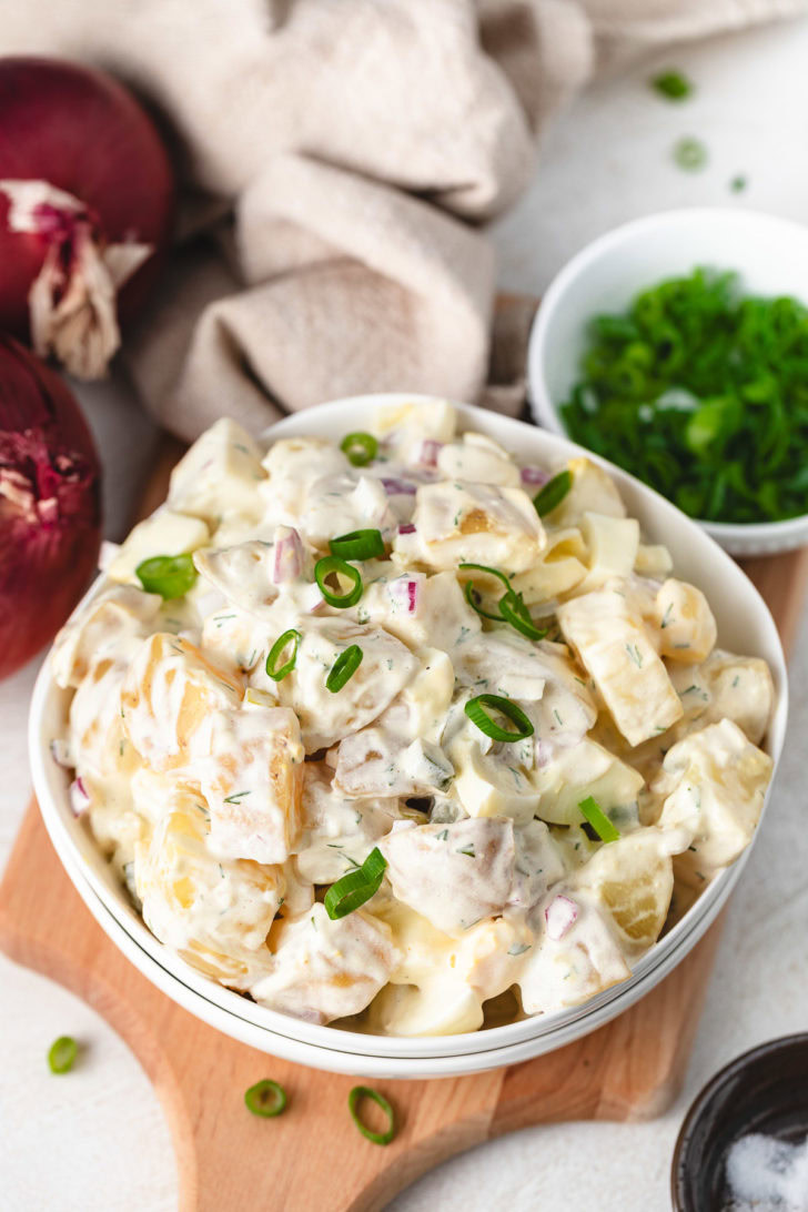Potato salad with dill pickles and eggs.