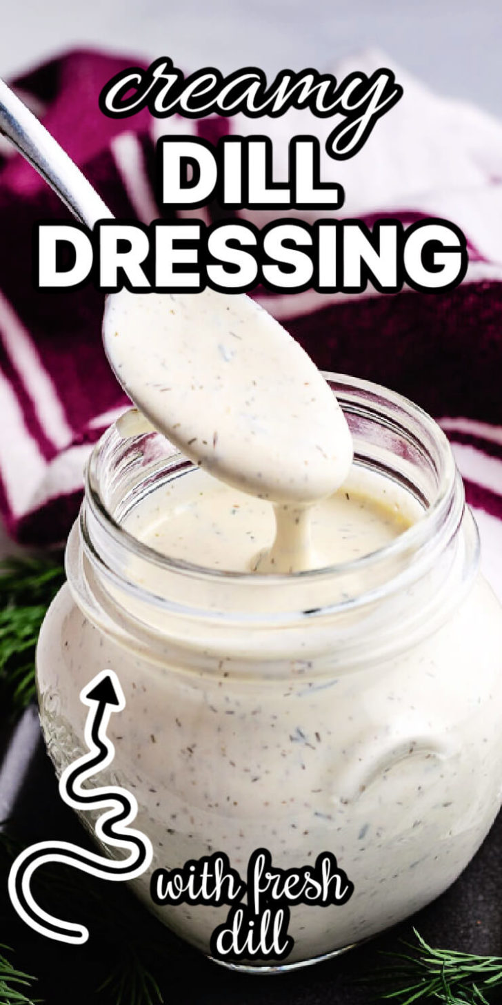 Spoon scooping up dill dressing from a jar.