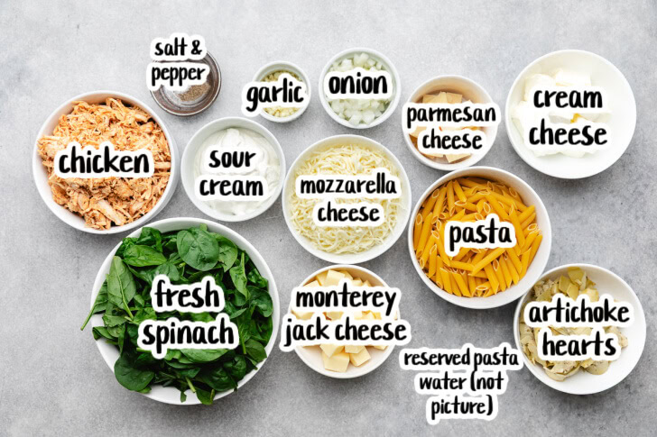 Ingredients used for slow cooker spinach artichoke chicken pasta.