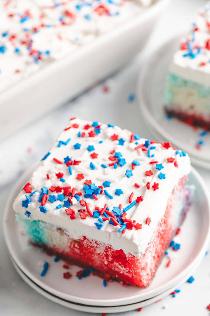 Red White And Blue Poke Cake Overhead view of patriotic poke cake with sprinkles.