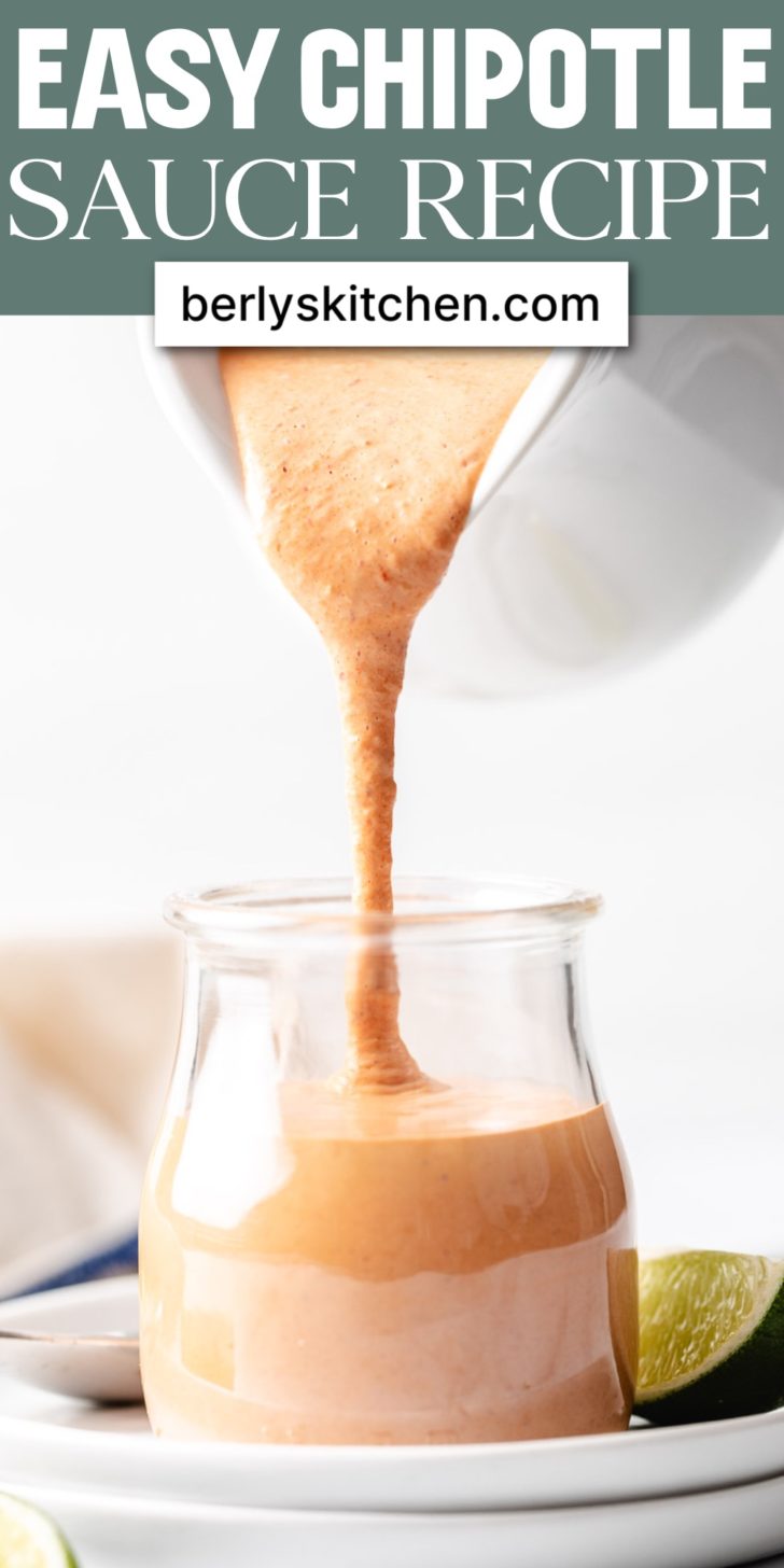 Chipotle sauce being poured into a jar.