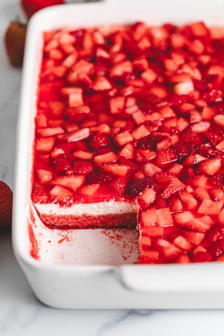 Strawberry delight in a white baking dish.