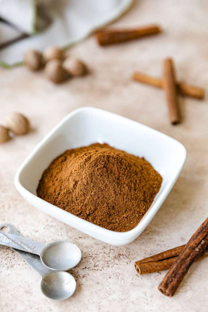 Apple Pie Spice White dish filled with apple pie mix.
