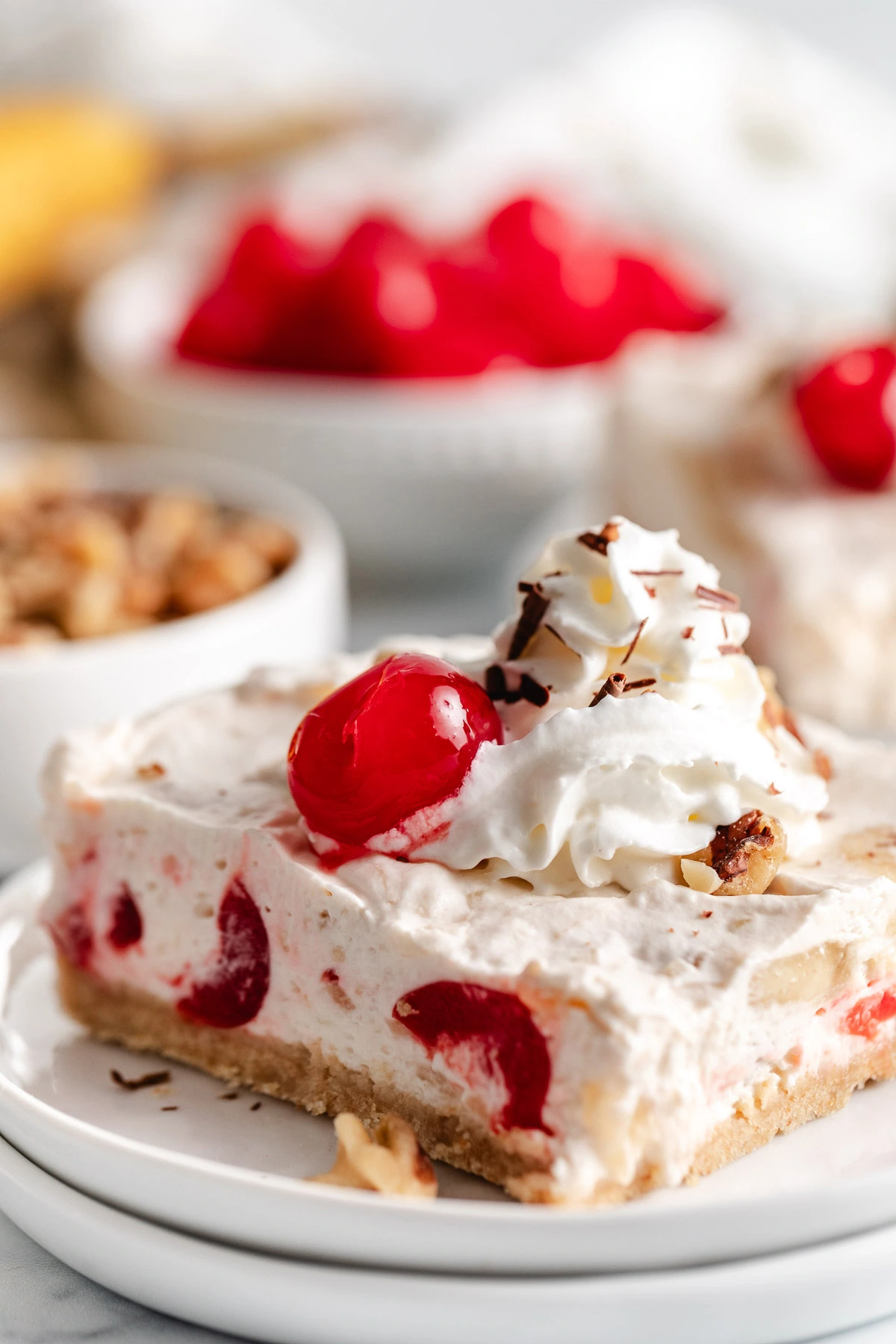 Banana split bars with whipped cream.