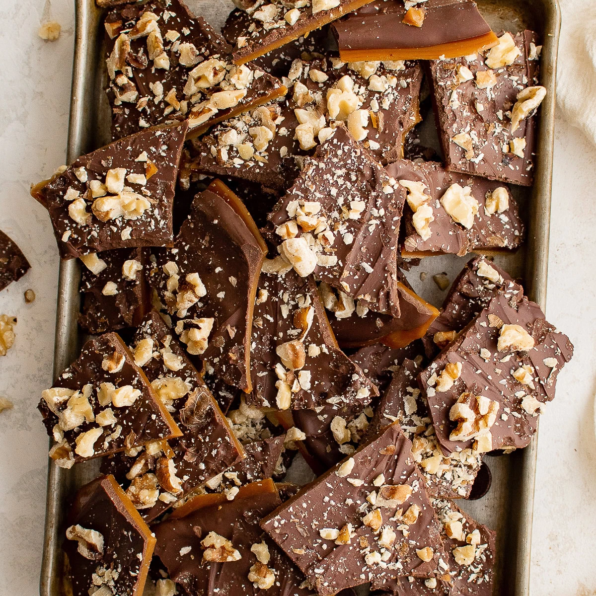 Overhead view of english toffee on a tray.