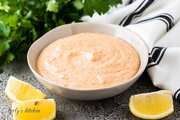 Gray dish filled with remoulade sauce.