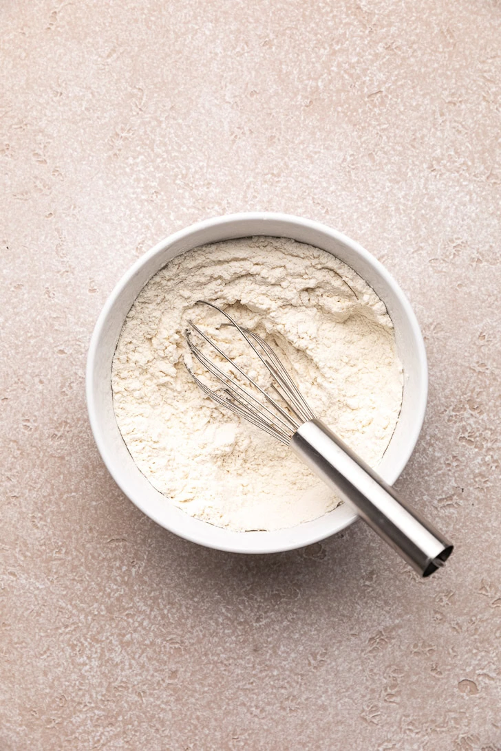 Whisk in a bowl of flour.