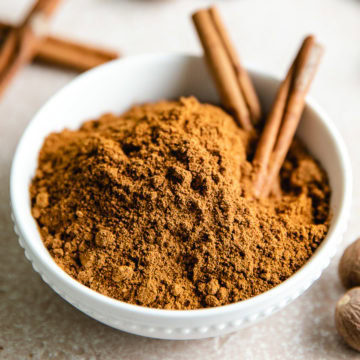 Close up of a white bowl holding pumpkin pie spice.
