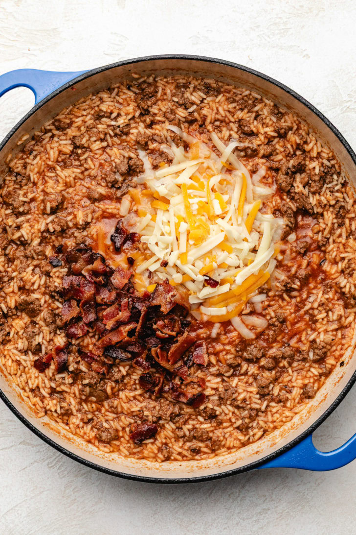 Bacon and cheese added to ground beef and rice skillet.