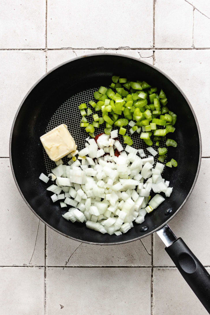 Butter, onion, and celery in a pan.