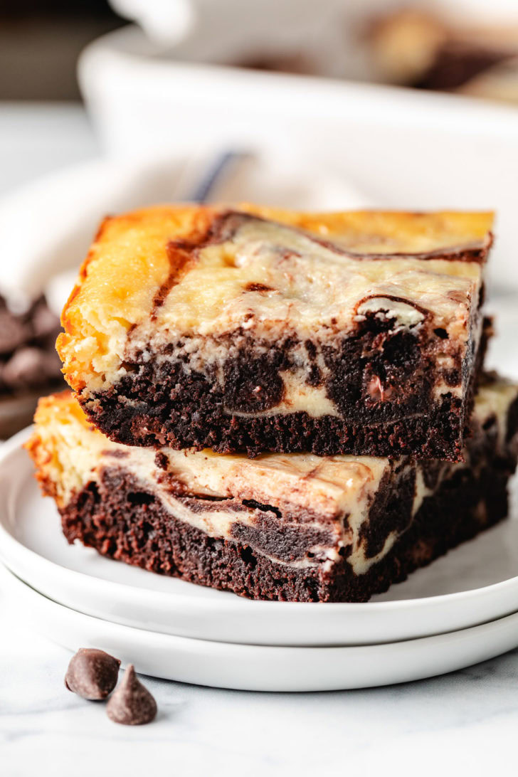 Stack of brownies on a plate.