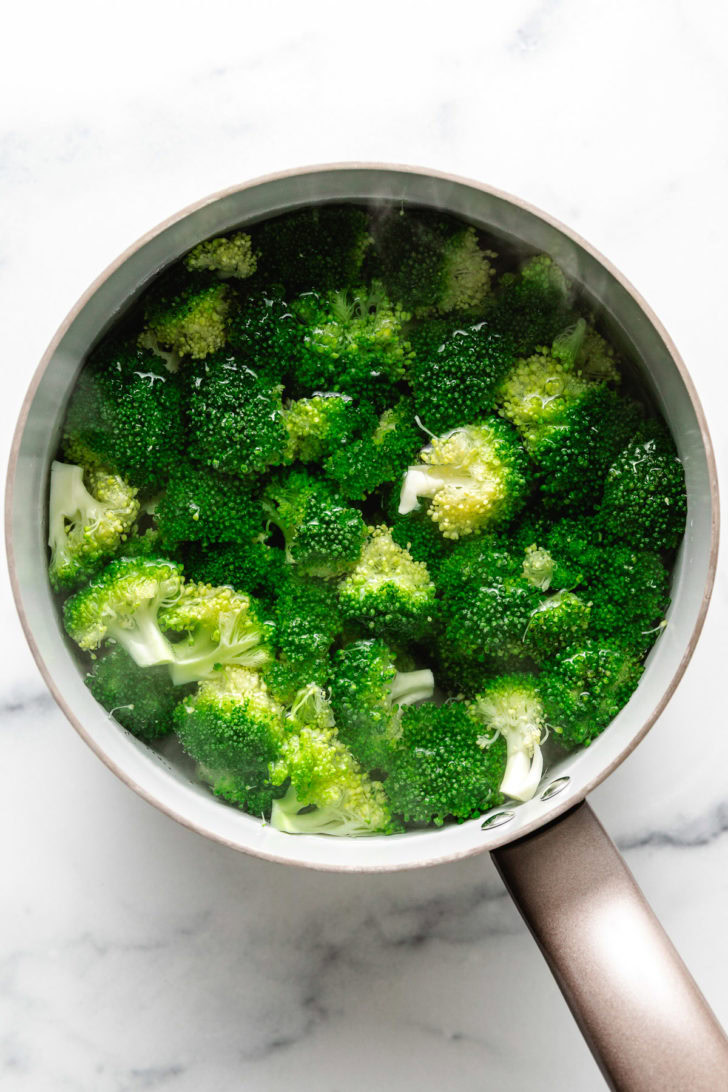 Broccoli blanching in a pan.