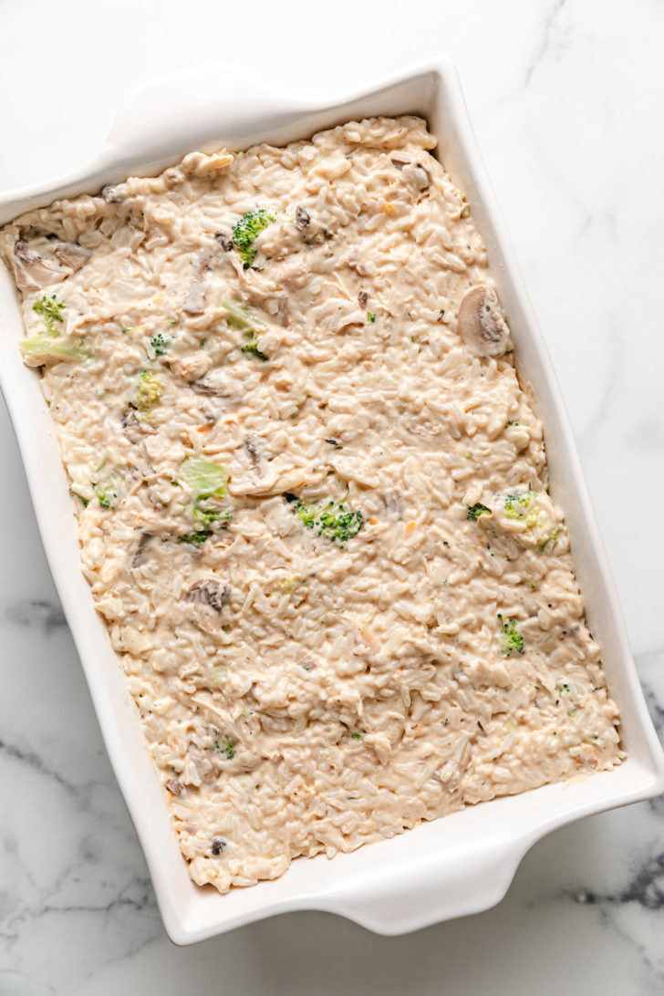 Chicken casserole mixture spread in a baking dish.