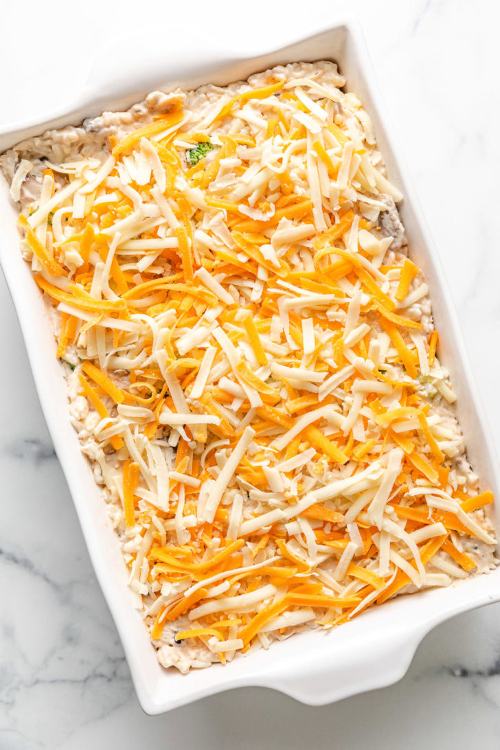 Shredded cheese added to a casserole.