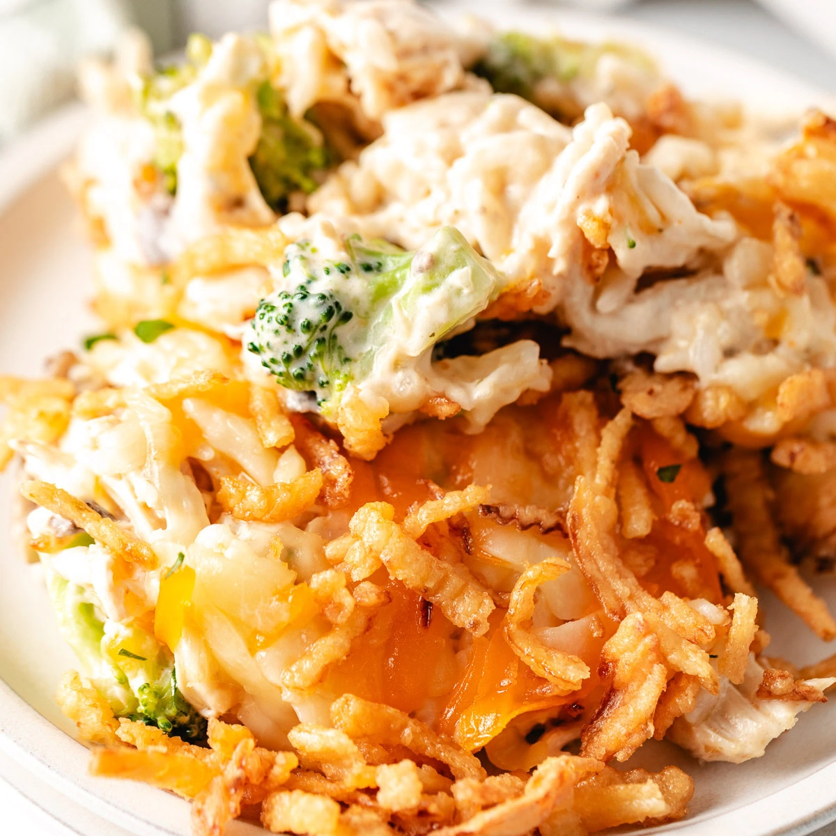 Close up view chicken mushroom broccoli casserole on a plate.